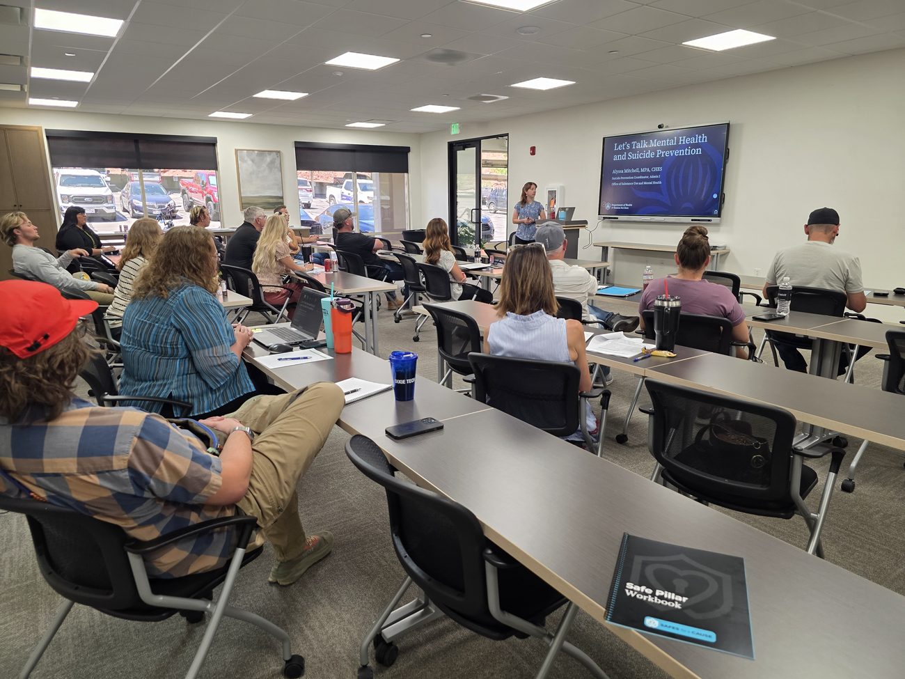 A full classroom of participants attending a SafeReach mental health and lethal means safety training session.